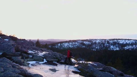 Man reaching the top of the rock in winter landscape Stock-Footage 105856952