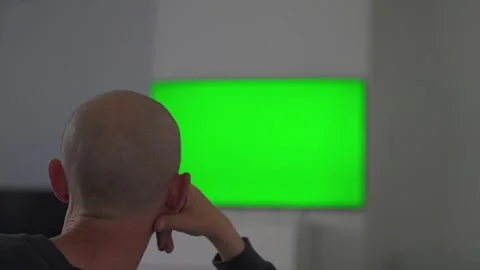 Man reaching toward green screen display Stock Footage 336373687