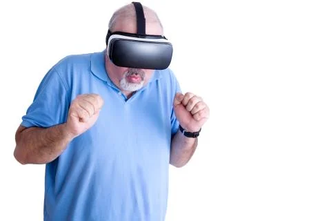 Man reacting to action in virtual headset Foto stock