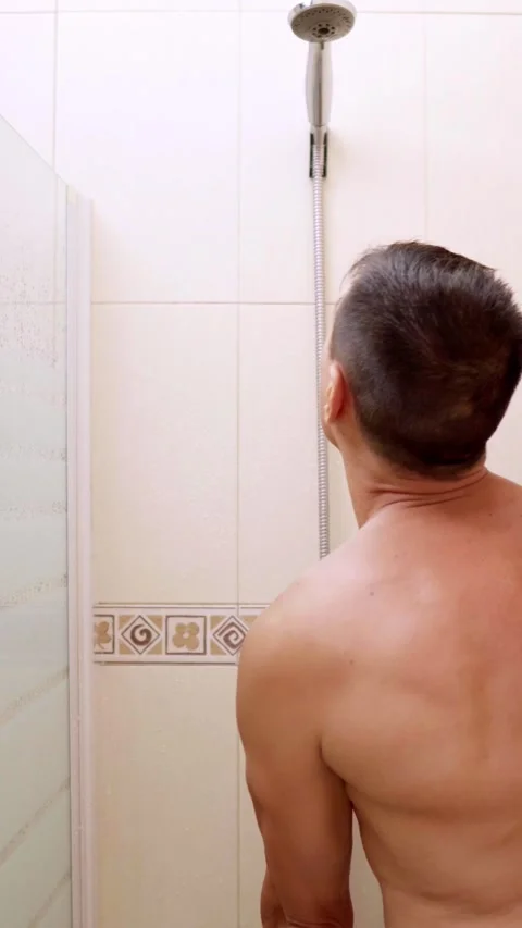 Man reacting to broken shower with shocking expression 스톡 동영상 313837353