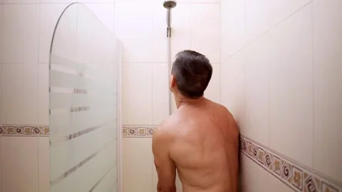 Man reacting to broken shower with shocking expression Stock Footage 314978116