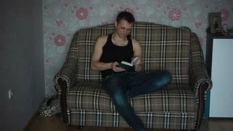 The man read the book and thought about it Stock Footage 87401204