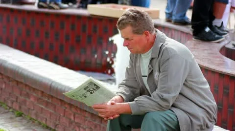 Man read newspaper Stock Footage 11974200