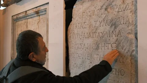 Man Reading Ancient Greek Script Stock Footage 168821829