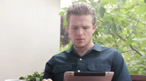 Man reading and drinking his coffee Stock Footage 40664830