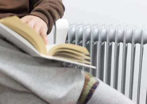 A man reading and leafing over the book. Stock Photos