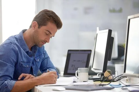 Man, reading and notebook in office for startup, schedule or review agenda .. Stock Photos