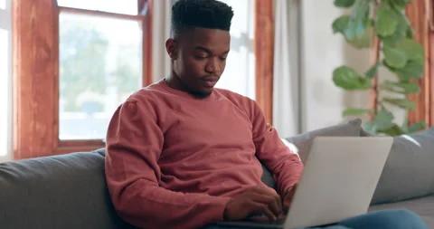 Man, reading and typing on laptop in home for communication with email, internet Stock Footage 253534960