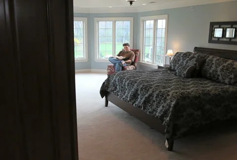 Man Reading in Bedroom Stock Footage 5186272