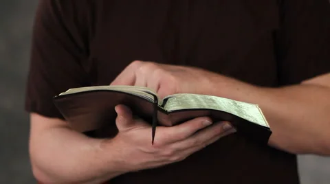Man Reading Bible Stock Footage 1068366