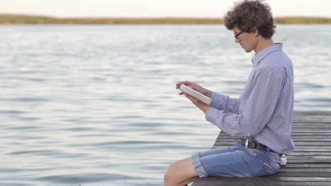 Man reading the Bible. Man reading a book. Stock Footage 119115588