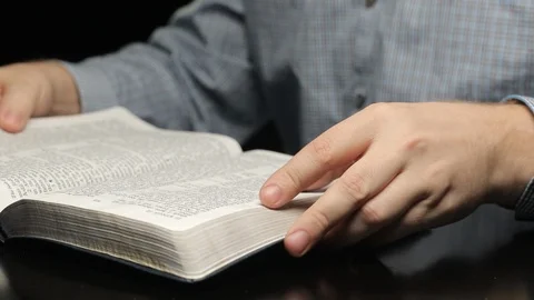 Man Reading Bible Tracking Slider High Stock Footage 91396089