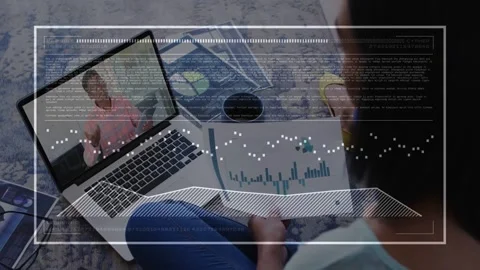 Man reading biz bar chart at home host gesturing on laptop causing overlay Stock Footage 333904991