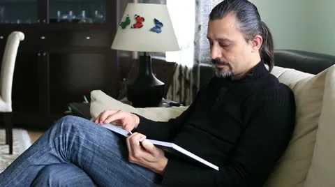 Man reading book and get the bad news Video stock 22154252