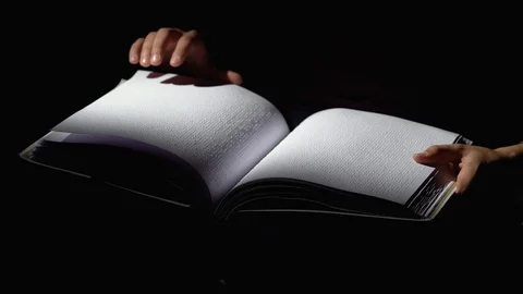 Man reading a book for the blind in a dark room . Close up 스톡 동영상 98135102