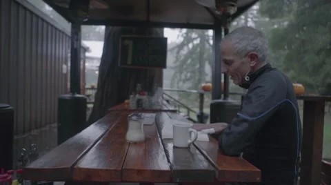 Man reading a book in cafe Stock Footage 63464646