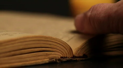 Man reading a book by candlelight. Stock Footage 711184