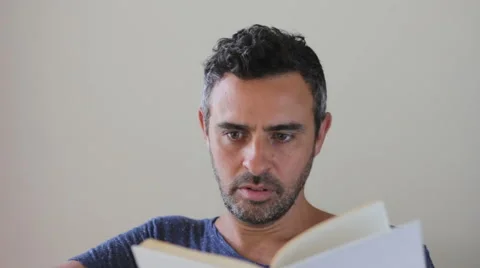 Man reading a book Stock Footage 40529198