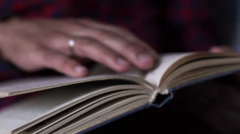 Man reading the book Stock Footage 64936508