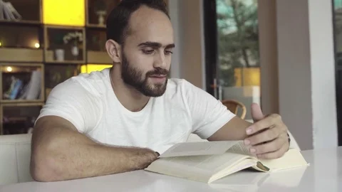 Man reading book Stock Footage 83035922