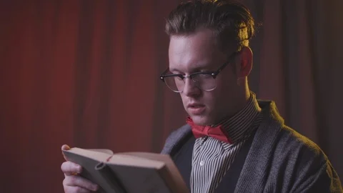 A man is reading a book. Stock Footage 118857721