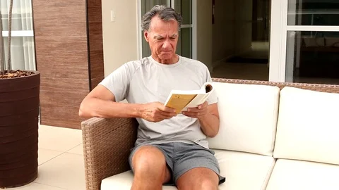 Man Reading Book Video stock 121585366