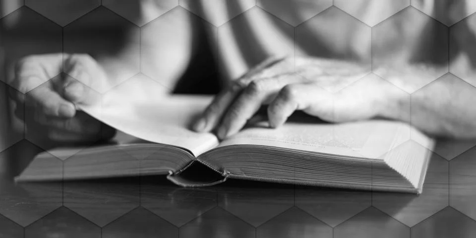 Man reading a book, geometric pattern Stock Photos