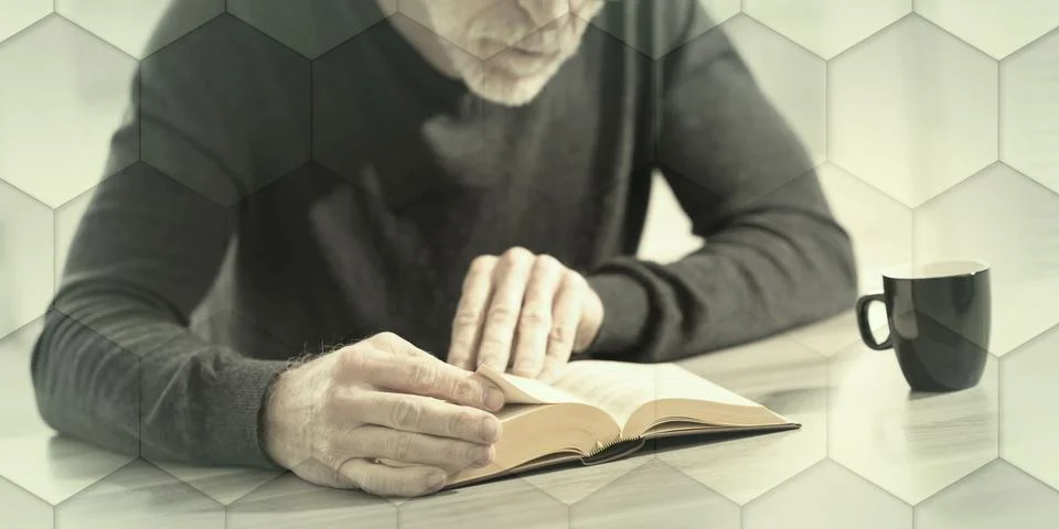 Man reading a book, geometric pattern 写真素材