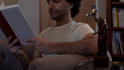 Man Reading Book in Library Stock Footage 99483071