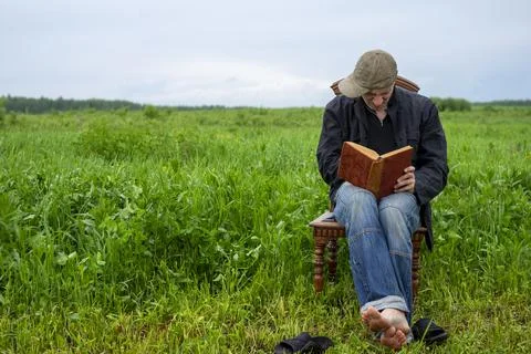 Man reading a book Photos