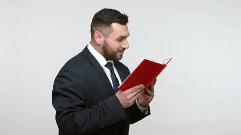 Man reading book, satisfied of plot, recommend for friends. Vídeos de archivo 159625772