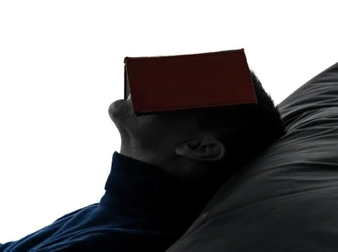 Man reading book silhouette portrait Stock Photos