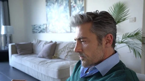 Man reading book in sofa Stock Footage 72739312