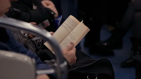 A man reading a book in a subway train in Russia Stock Footage 87202467
