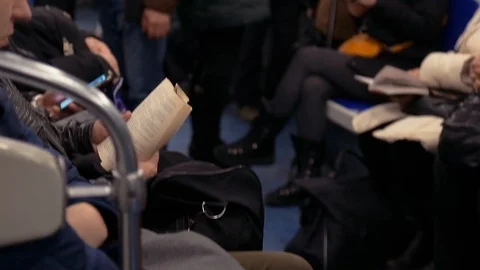 A man reading a book in a subway train in Russia Stock Footage 87202508