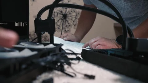 Man reading build diagram before installing cooler system Video stock 324593118
