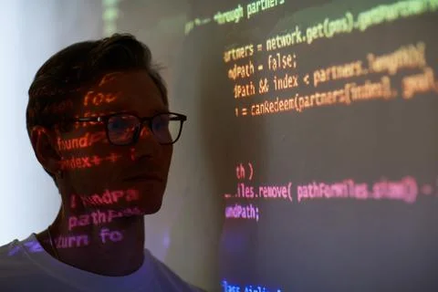 Man reading computer code Stock Photos