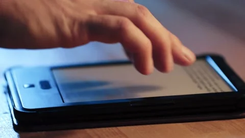 A man reading an electronic book Stock Footage 224893729