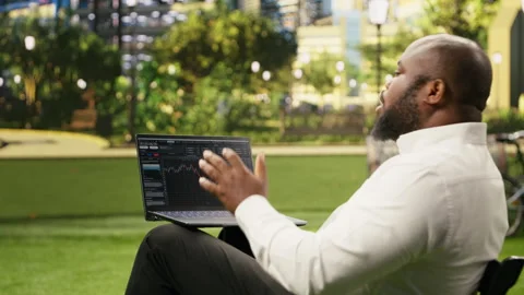 Man reading financial data graphs on forex web platform Video stock 343501324