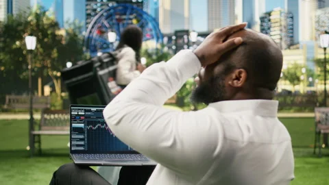 Man reading financial data graphs on forex web platform 스톡 동영상 343507399