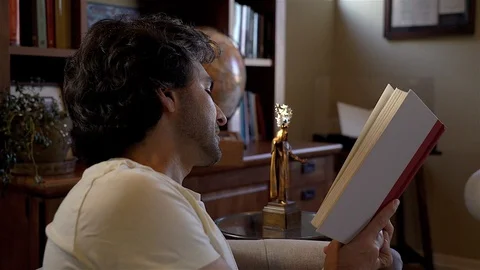 Man Reading to himself Stock Footage 99483127