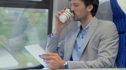 Man reading on his tablet while traveling on the train Stock Footage 67261457