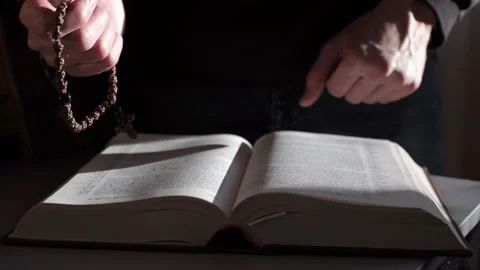 A man is reading the Holy Bible. The concept of prayer, religion, faith Stock Footage 221507601