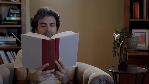 Man Reading in Home Library Stock Footage 99483083