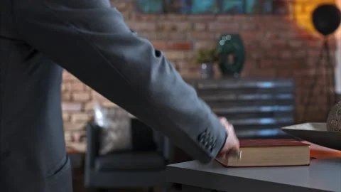 Man reading home - virus protective mask on desk Stock Footage 132918193