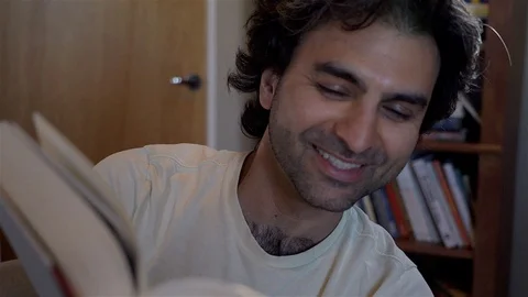 Man Reading Humor Stock Footage 99483086