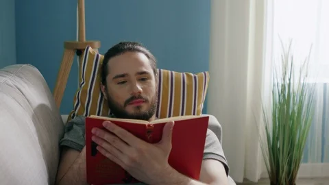 Man Is Reading Interesting Book Stock Footage 129888383
