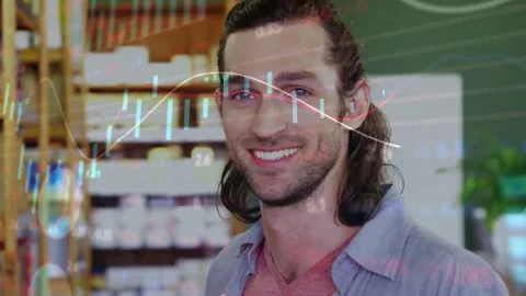 Man reading label while browsing in retail, looking up and smiling as data Stock Footage 332316525