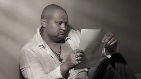 Man reading letter Stock Footage 8607295