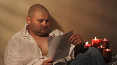 Man reading letter Stock Footage 8607767